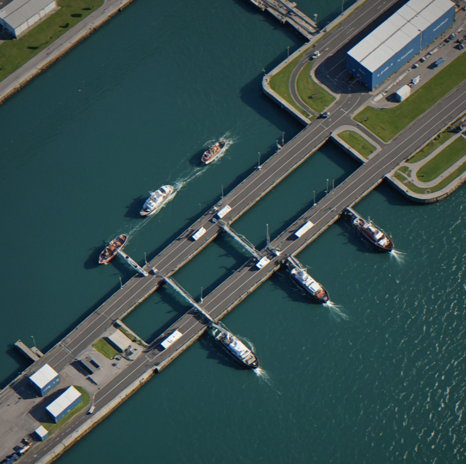 Bird's-eye view of a port channel with two vessels approaching at different angles, wake patterns and collision zones highlighted